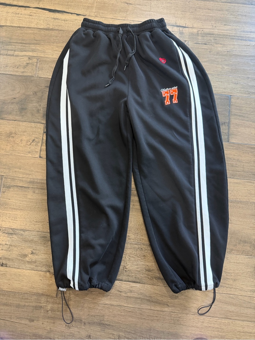 Aelfric Eden Black sweatpants with White Side Stripes and Orange 77 Accent